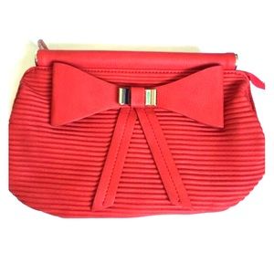 Bow quilted clutch